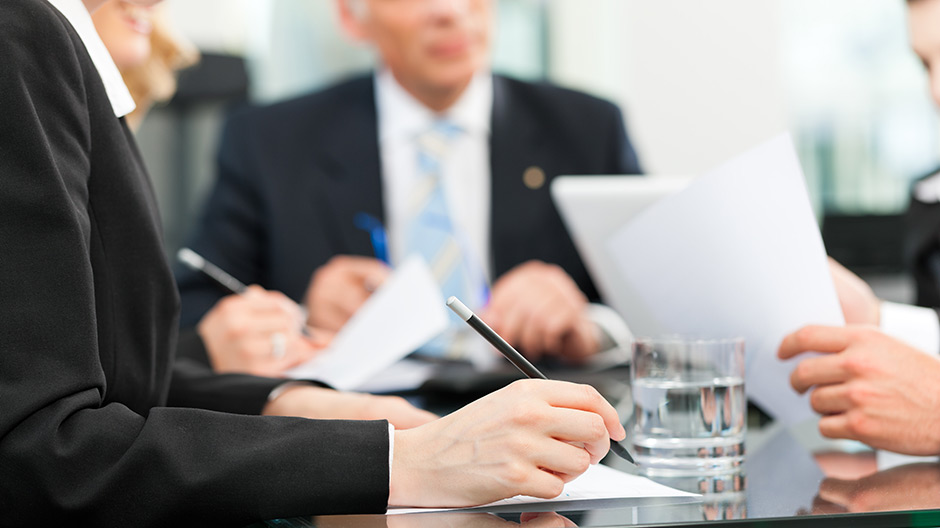 Business meeting with work on contract