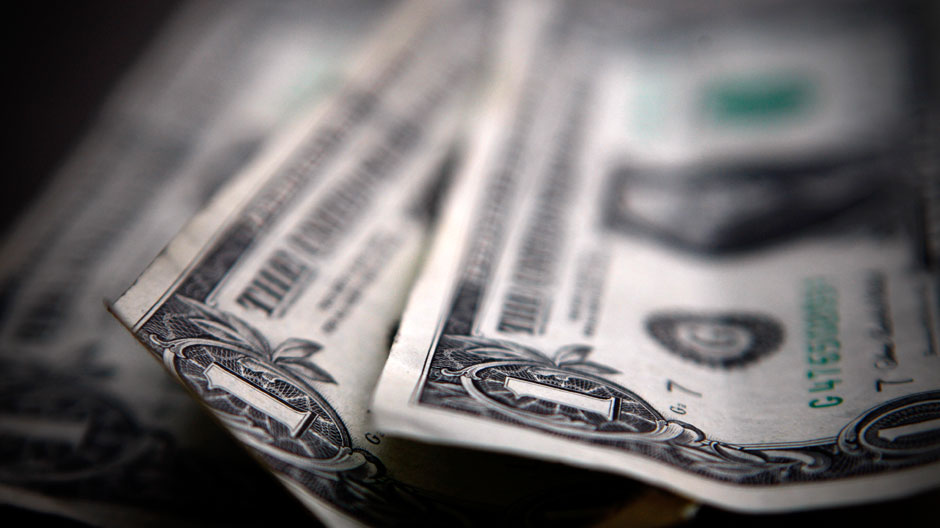 U.S. dollar bills are displayed in Toronto March 26, 2008